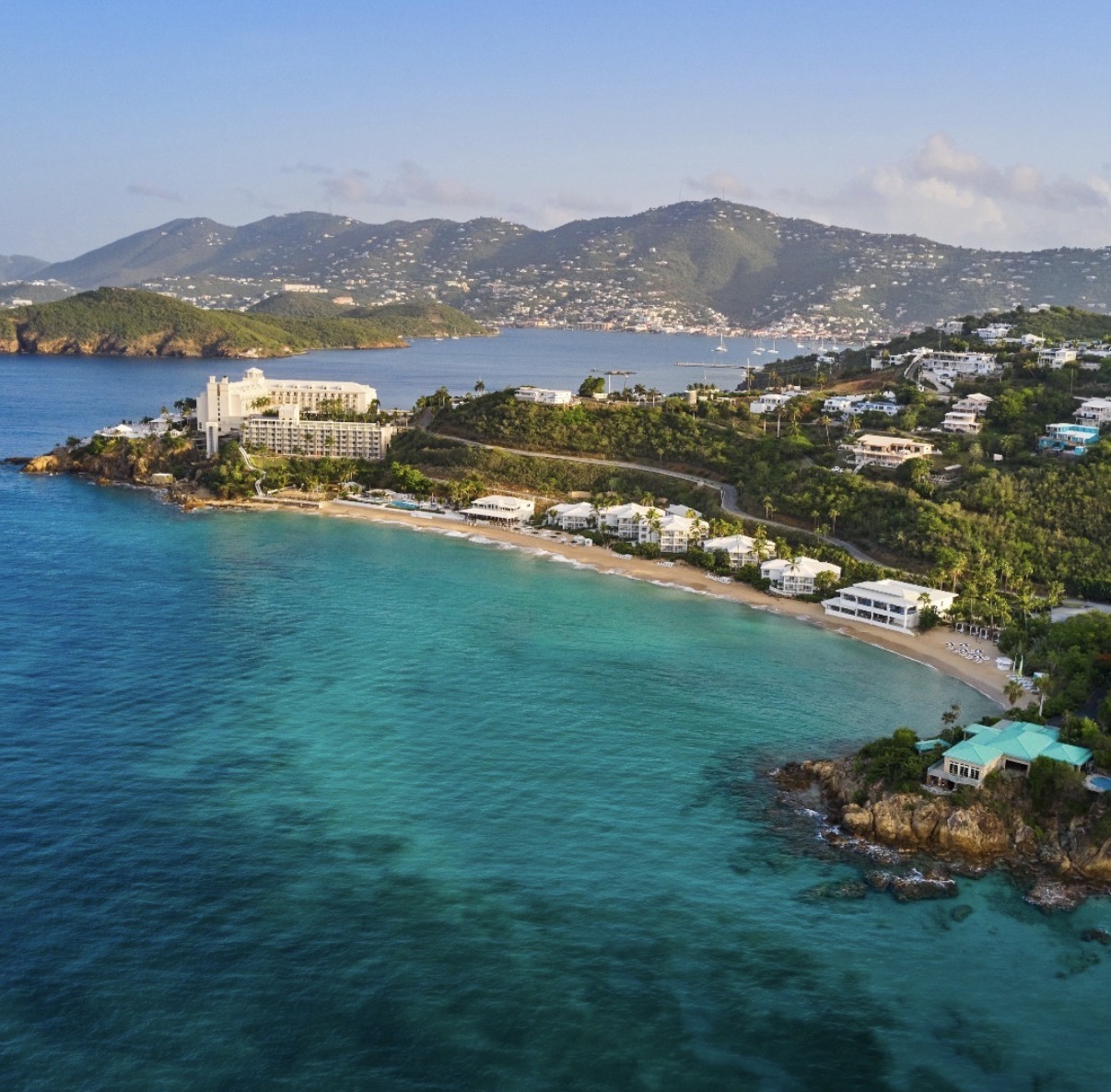 Aerial view of St. Thomas coastline with resorts and turquoise waters